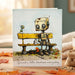 Greeting card with a robot and bird on a bench, featuring the text 'Spread a little kindness everyday'.