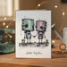 Stamp of two robots holding hands with 'Better Together' text on a card.