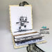 Open book with a robot stamp on a white background