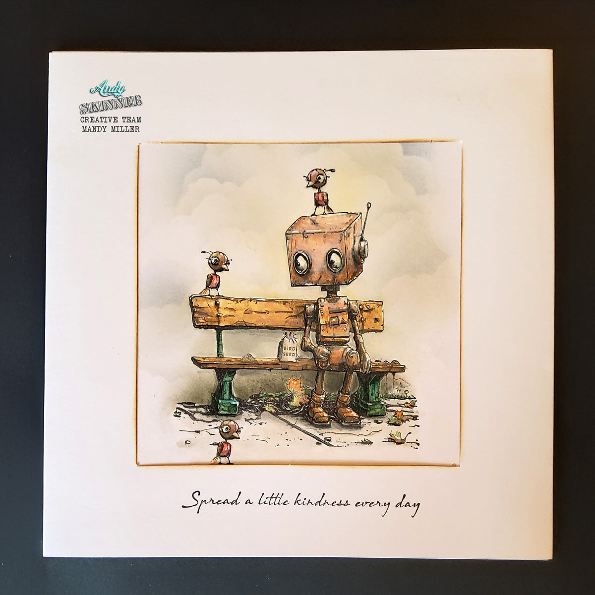 Illustration of a robot sitting on a bench with text 'Spread a little kindness every day' on a card.