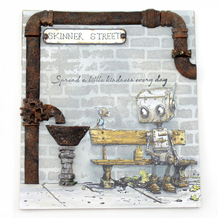 Robotic character sitting on a bench with 'Skinner Street' and 'Spread a little kindness every day' text on a brick wall background with pipes going around the left and top edge.