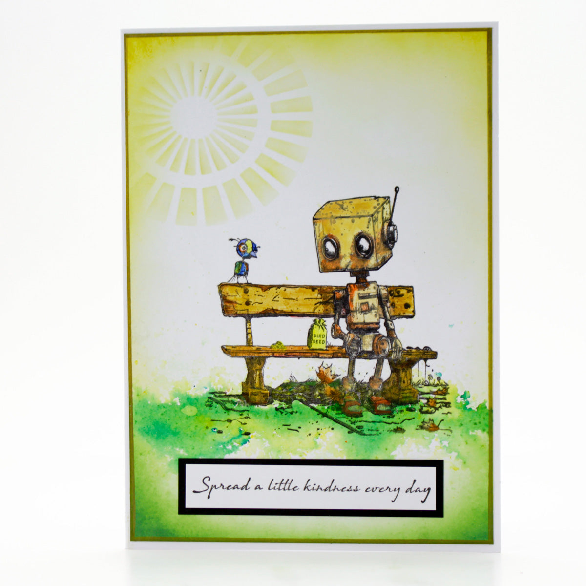 Illustration of a robot and a bird on a bench with a sun in the background, featuring the text 'Spread a little kindness every day'.