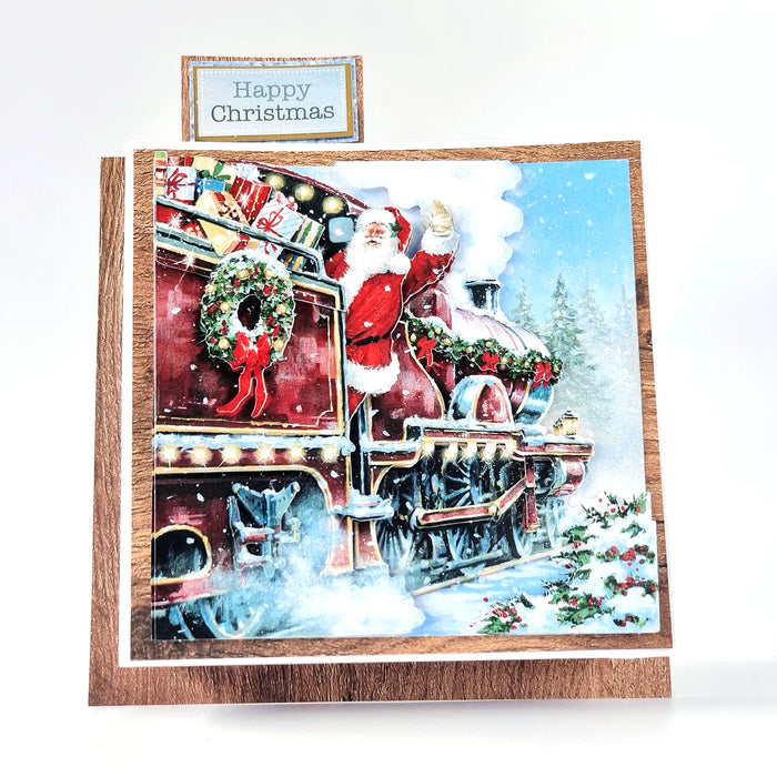 Gestanztes Decoupage – Weihnachtsmann im Zug (3er-Pack)